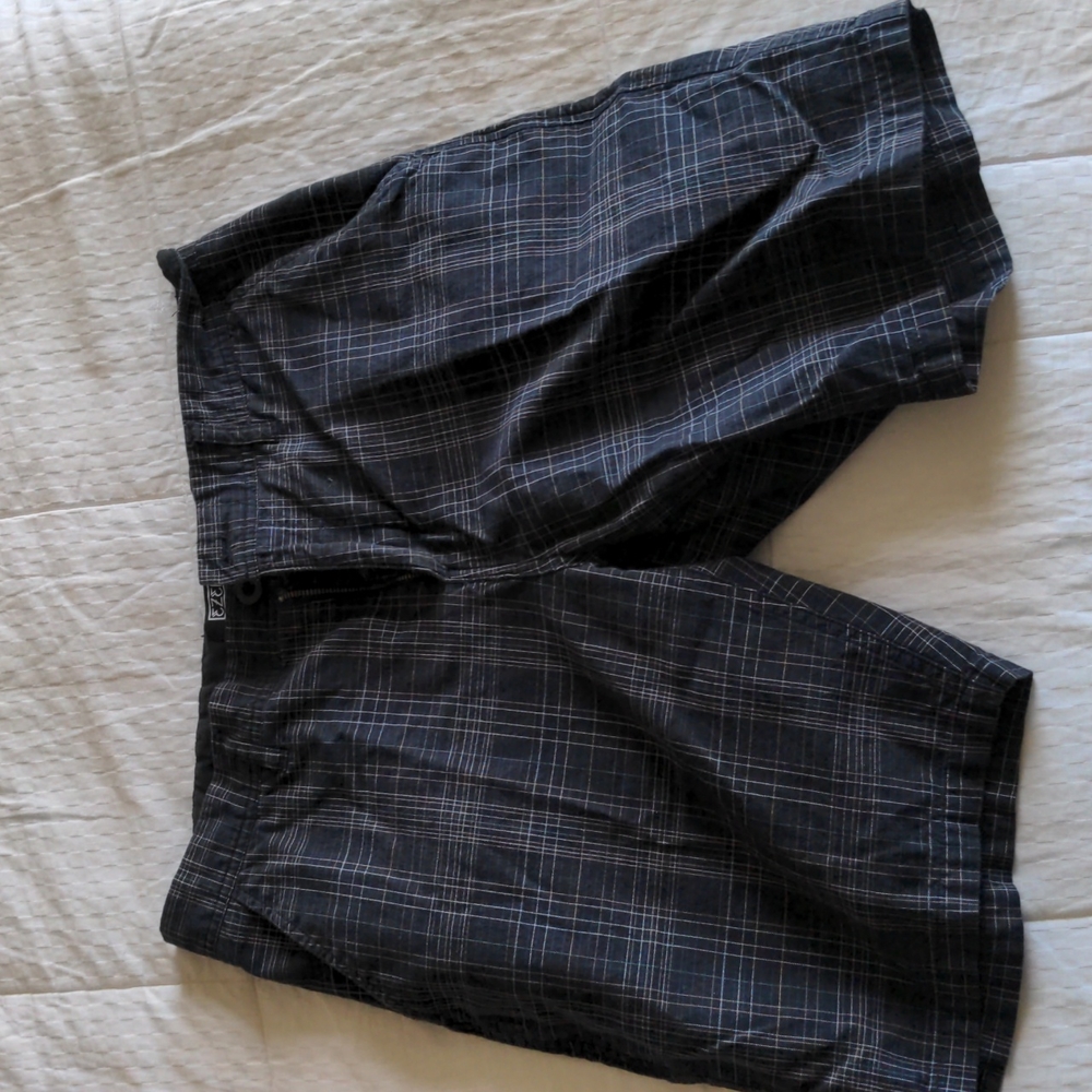 Men's shorts. Dress or casual. Black with colors. Size 31. Great condition.